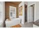 This bathroom features a soaking tub under a window and a separate glass-enclosed shower at 6815 Halcyon Way, Alpharetta, GA 30005