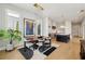 Dining area with hardwood floors, modern chandelier, and views into kitchen at 6815 Halcyon Way, Alpharetta, GA 30005