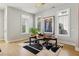 Bright dining area features hardwood floors and multiple windows overlooking the backyard at 6815 Halcyon Way, Alpharetta, GA 30005