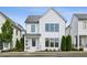Charming two-story home with white brick exterior and black window trim at 6815 Halcyon Way, Alpharetta, GA 30005