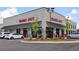A Trader Joe's retail store with a brick facade, black awnings, and ample parking at 6815 Halcyon Way, Alpharetta, GA 30005