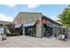 Kilwins storefront featuring a classic awning, outdoor seating, and inviting display windows at 6815 Halcyon Way, Alpharetta, GA 30005