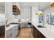 Modern kitchen features gray cabinets, stainless steel appliances, a gas range, and granite countertops at 6815 Halcyon Way, Alpharetta, GA 30005