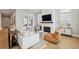 Bright living room with fireplace, hardwood floors, and large windows at 6815 Halcyon Way, Alpharetta, GA 30005