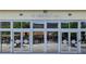 The Market Hall entrance features a glass facade and signage for a welcoming and attractive entryway at 6815 Halcyon Way, Alpharetta, GA 30005