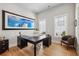 Stylish home office with ample natural light, a large desk, and hardwood floors at 6815 Halcyon Way, Alpharetta, GA 30005
