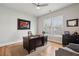 This office offers natural light with a desk and chair at 6815 Halcyon Way, Alpharetta, GA 30005