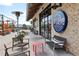 Outdoor seating area at Ocean & Acre with a brick facade and stylish outdoor furniture at 6815 Halcyon Way, Alpharetta, GA 30005