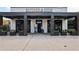 Butcher & Brew exterior featuring a sleek, modern facade and outdoor seating at 6815 Halcyon Way, Alpharetta, GA 30005