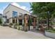 Outdoor dining area at Cherry Street Brewpub, complete with wooden pergola and lush plantings at 6815 Halcyon Way, Alpharetta, GA 30005