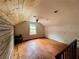 This bright attic offers wooden floors, a window and an interesting wooden accent wall at 1238 Trenton St, Atlanta, GA 30316