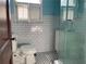 Bathroom showcasing a glass shower, white subway tiles, and black and white floors at 1238 Trenton St, Atlanta, GA 30316