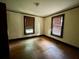 Bedroom featuring hardwood floors and natural light from two windows at 1238 Trenton St, Atlanta, GA 30316