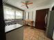 Well-lit kitchen with light cabinets, stainless steel appliances, and tile flooring at 1238 Trenton St, Atlanta, GA 30316