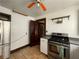 Kitchen featuring stainless steel appliances, tile floors, and a view of a spiral staircase at 1238 Trenton St, Atlanta, GA 30316