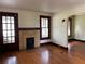 Inviting living room with hardwood floors and a decorative brick fireplace at 1238 Trenton St, Atlanta, GA 30316