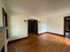 Bright living room featuring hardwood floors, neutral walls, fireplace, and archway at 1238 Trenton St, Atlanta, GA 30316