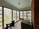Cozy sunroom offers large windows and space for relaxing, reading, or quiet reflection at 1238 Trenton St, Atlanta, GA 30316