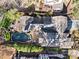 Aerial view of a private backyard pool with a hot tub, patio and landscaping with mature trees and privacy fence at 1352 Middlesex Ne Ave, Atlanta, GA 30306