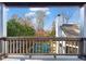 Balcony view overlooking a gorgeous backyard, glistening pool, and lush landscaping at 1352 Middlesex Ne Ave, Atlanta, GA 30306