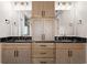 Elegant bathroom featuring double sinks with black marble countertops and modern fixtures at 1352 Middlesex Ne Ave, Atlanta, GA 30306