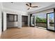 Bedroom with hardwood floors, balcony access, and organized closet shelving at 1352 Middlesex Ne Ave, Atlanta, GA 30306