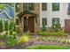 Charming front door, well manicured landscaping, and stone exterior accents at 1352 Middlesex Ne Ave, Atlanta, GA 30306