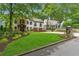 Charming two-story home with a stone accent wall, white stucco, and a well-manicured lawn at 1352 Middlesex Ne Ave, Atlanta, GA 30306