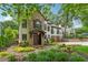 Charming two-story home with a stone accent wall, white stucco, and a well-manicured lawn at 1352 Middlesex Ne Ave, Atlanta, GA 30306