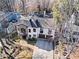 Stately two-story stucco home featuring a stone-clad facade, attached garages, and professionally landscaped front yard at 1352 Middlesex Ne Ave, Atlanta, GA 30306