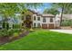 Charming two-story home with a stone accent wall, white stucco, and a well-manicured lawn at 1352 Middlesex Ne Ave, Atlanta, GA 30306