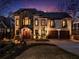Elegant two-story home with stone and stucco exterior, accentuated by manicured landscaping and a cozy front entry at 1352 Middlesex Ne Ave, Atlanta, GA 30306