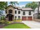 Charming two-story home with a stone facade, stucco accents, and a well-manicured front yard, enhancing its curb appeal at 1352 Middlesex Ne Ave, Atlanta, GA 30306