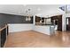 Open floorplan of the kitchen with marble island countertop, stainless steel appliances, and wood floors at 1352 Middlesex Ne Ave, Atlanta, GA 30306