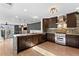Bright, modern kitchen featuring stainless appliances, marble countertops and island, open to living area at 1352 Middlesex Ne Ave, Atlanta, GA 30306
