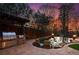 Backyard outdoor kitchen with an infinity pool at sunset at 1352 Middlesex Ne Ave, Atlanta, GA 30306