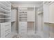 Spacious walk-in closet with custom shelving, drawers, and stylish fixtures for organization at 1352 Middlesex Ne Ave, Atlanta, GA 30306