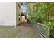 Backyard featuring a side view of the deck and stairs leading to it at 1417 Sterlingbrooke Dr, Powder Springs, GA 30127