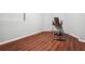 Finished basement area with hardwood floors and an inversion table at 1417 Sterlingbrooke Dr, Powder Springs, GA 30127