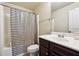 Bathroom featuring a shower-tub combo, a toilet, and a vanity with a sink and mirror at 1417 Sterlingbrooke Dr, Powder Springs, GA 30127