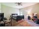 Bedroom with neutral-colored walls and carpeting, and a dark-wood bed frame at 1417 Sterlingbrooke Dr, Powder Springs, GA 30127
