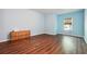 Bright bedroom featuring hardwood floors and ample natural light from the window at 1417 Sterlingbrooke Dr, Powder Springs, GA 30127