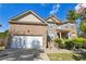 Charming two-story brick home featuring an attached garage and landscaped front yard at 1417 Sterlingbrooke Dr, Powder Springs, GA 30127