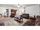 Open concept living room with seamless flow to the kitchen and dining area at 1417 Sterlingbrooke Dr, Powder Springs, GA 30127