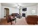 Inviting living room with fireplace, comfortable seating, and access to the backyard at 1417 Sterlingbrooke Dr, Powder Springs, GA 30127