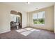 Bright living room with neutral walls, large window with blinds, and carpeted floors at 1417 Sterlingbrooke Dr, Powder Springs, GA 30127