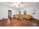 Inviting living room featuring hardwood floors and a comfortable sectional sofa at 1417 Sterlingbrooke Dr, Powder Springs, GA 30127