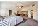Spacious bedroom with a ceiling fan and natural light, creating a cozy and inviting atmosphere at 1417 Sterlingbrooke Dr, Powder Springs, GA 30127