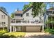 Exterior view of a two-story home featuring a garage, deck, and well-maintained yard at 2356 Defoors Ferry Nw Rd, Atlanta, GA 30318