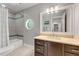 Traditional bathroom with a bathtub/shower combination, a vanity, and a window to let light in at 2356 Defoors Ferry Nw Rd, Atlanta, GA 30318